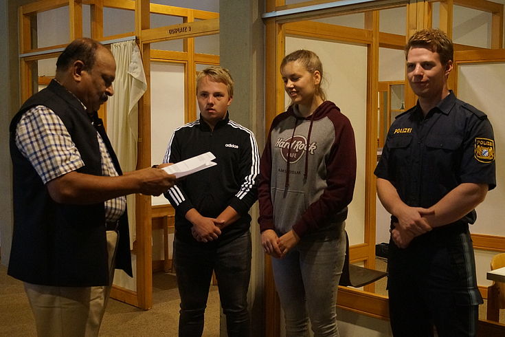 Bavarian police trainees play through a domestic violence scenario created by the Indian delegation